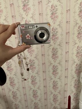 Samsung Silver Camera with Pink and Orange Floral Accents